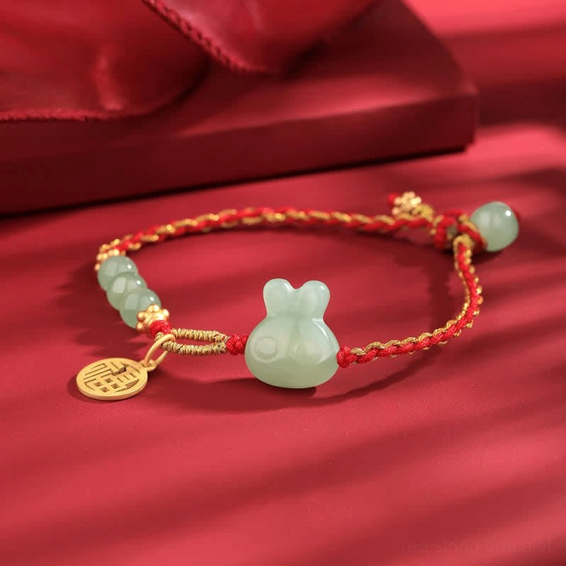 Silver fu charm and jade rabbit pendant on Year of the Rabbit red string bracelet