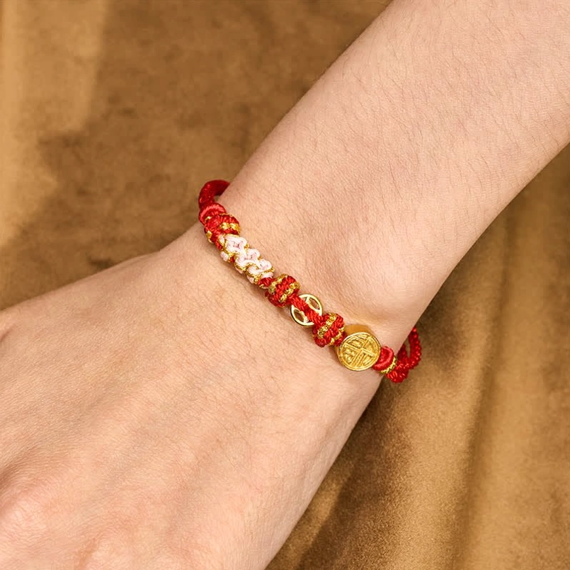 Fu character red string bracelet worn on wrist adjustable fit display