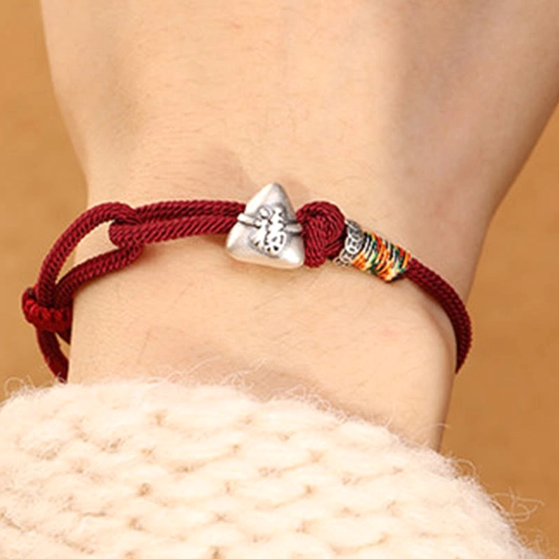 Fu zongzi red string bracelet worn on wrist with knitted sleeve