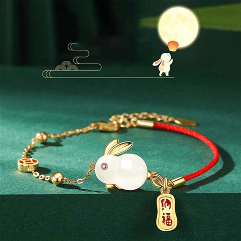 Year of the Rabbit red string bracelet full display with moon rabbit graphic background