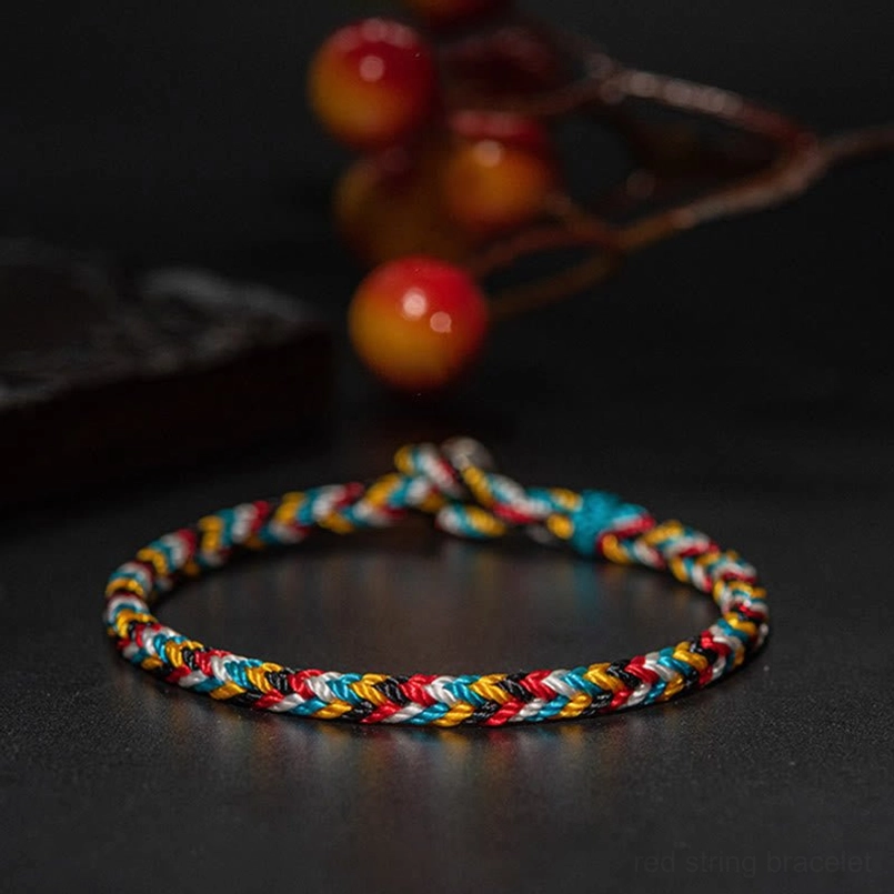 Full uniform braided pattern of Tibetan five color red string bracelet top view