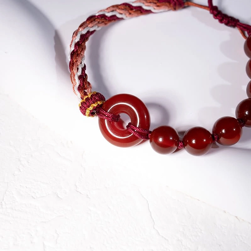 Full View Red Agate Peace Buckle Red String Bracelet High Angle Shot