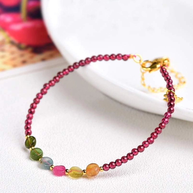Garnet tourmaline protection bracelet with gold clasp and mixed tourmaline accent beads