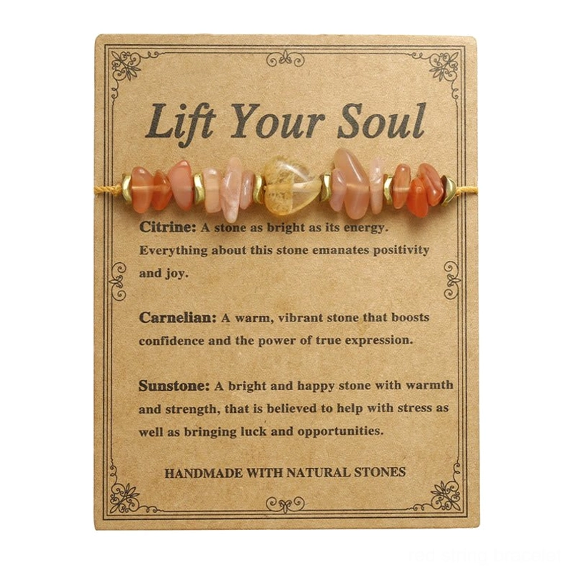 Citrine carnelian sunstone red string bracelet displayed on kraft product information card