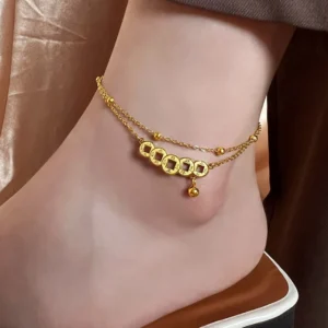 Gold copper coins double-strand titanium steel anklet worn on ankle with satin background styling