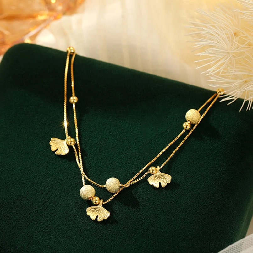 Gold plated double layer ginkgo leaf anklet frosted beads on velvet display