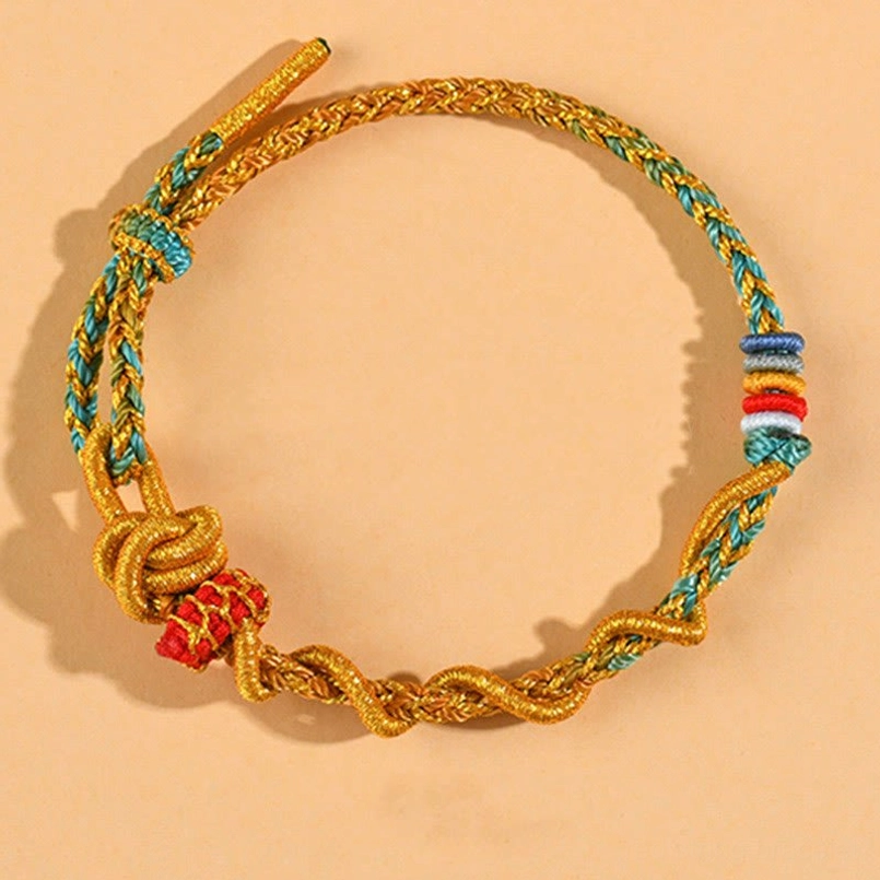 Gold-green dimple knot luck bracelet for balance and harmony in Year of the Snake