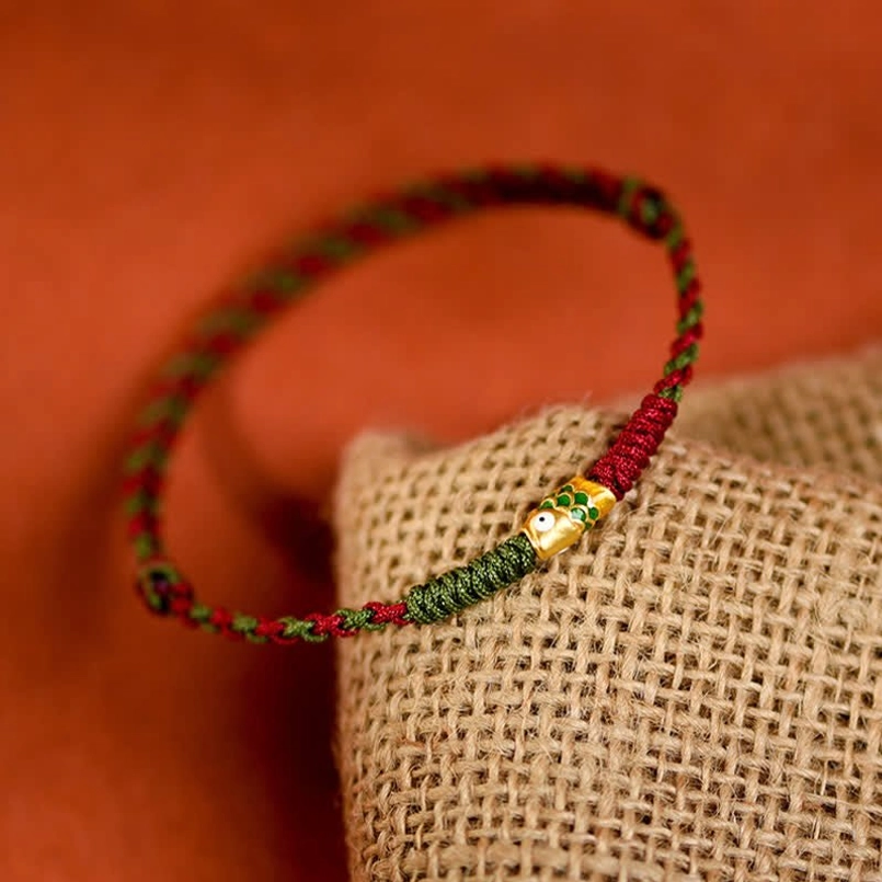 Gold koi fish charm on red green braided lucky string bracelet
