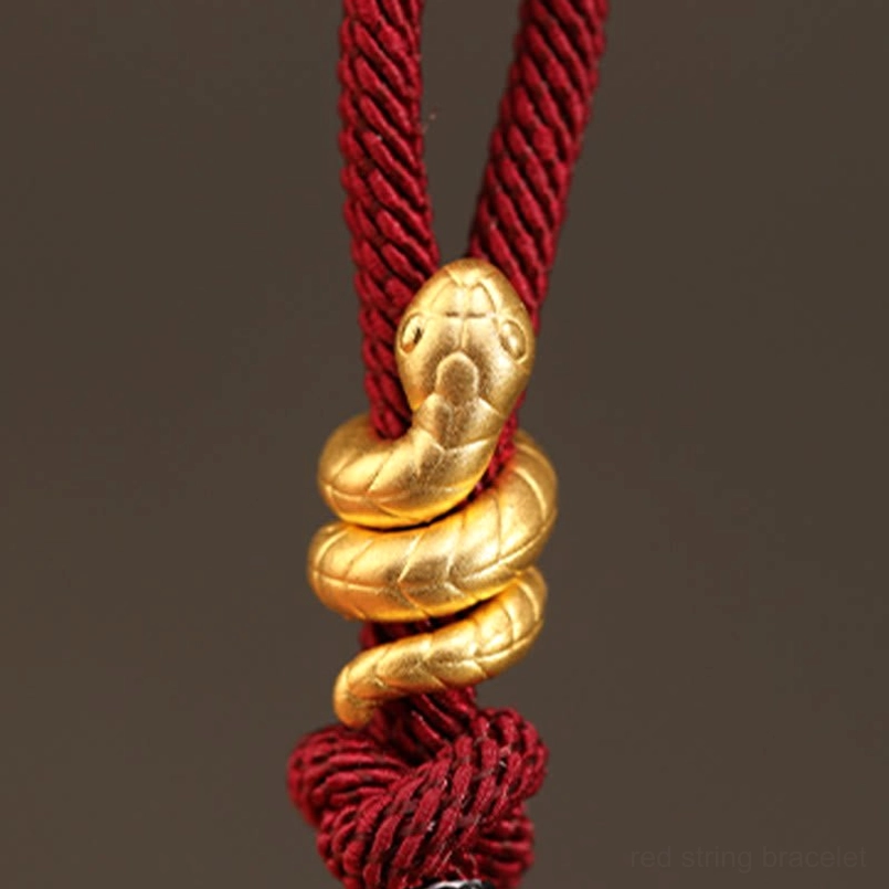 year of the snake red string bracelet placed on luxury gift box packaging