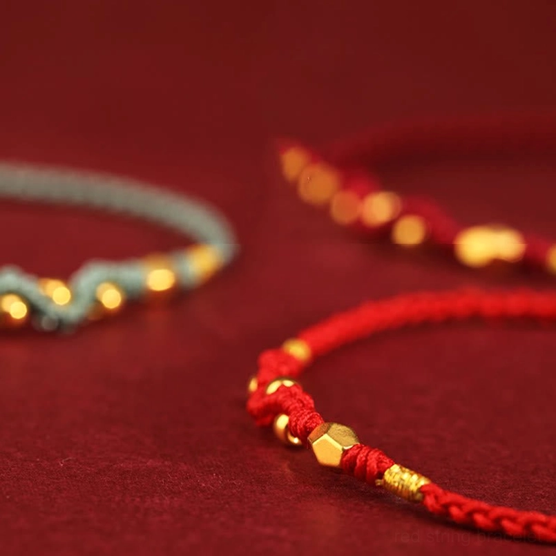 999 gold snake red string bracelet with mini gold beads detail close up