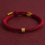 999 gold triple ring red string bracelet handmade connection charm three-quarter view