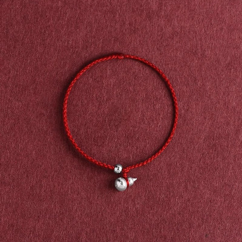 dark red rope gourd bracelet with sterling silver charm detail