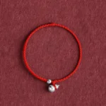 925 sterling silver gourd lucky fortune red string bracelet flat lay overhead view