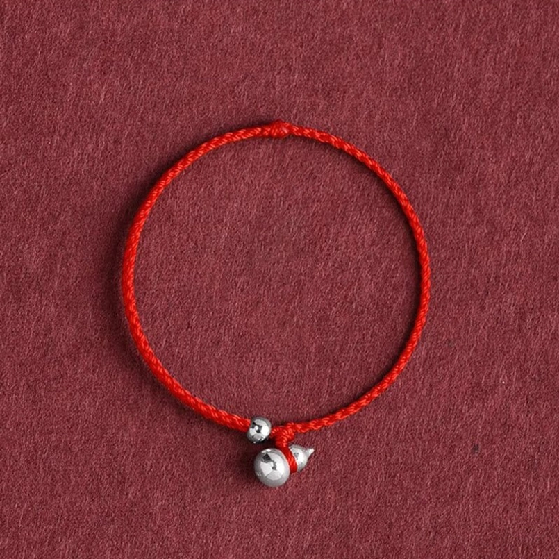 925 sterling silver gourd lucky fortune red string bracelet flat lay overhead view