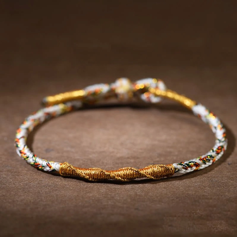 Gray Horse Mahasattva Bodhisattva red string bracelet flat lay