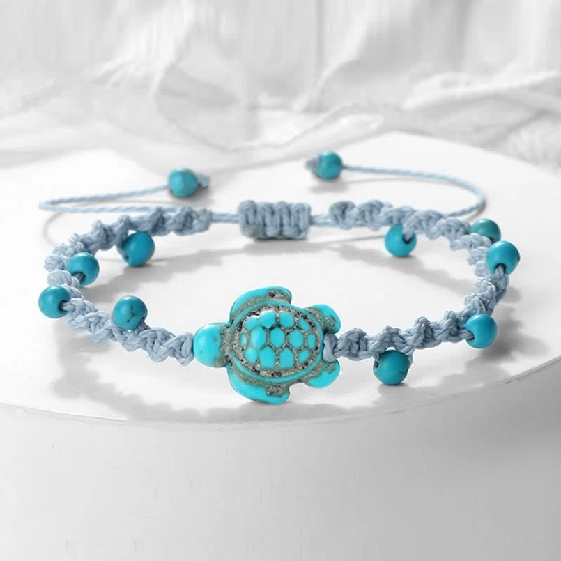 Gray braided rope turtle bracelet with adjustable knots