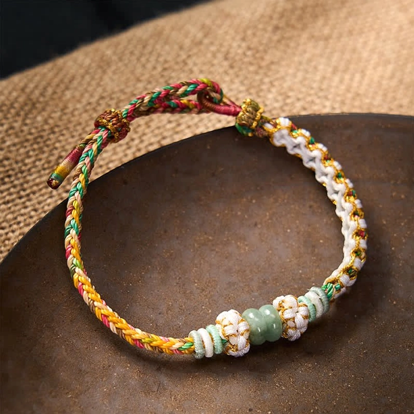 Green string luck bracelet with adjustable fastener and natural jade beads
