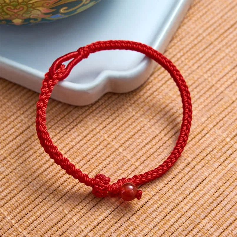 Green aventurine red string balance bracelet natural stone texture and color