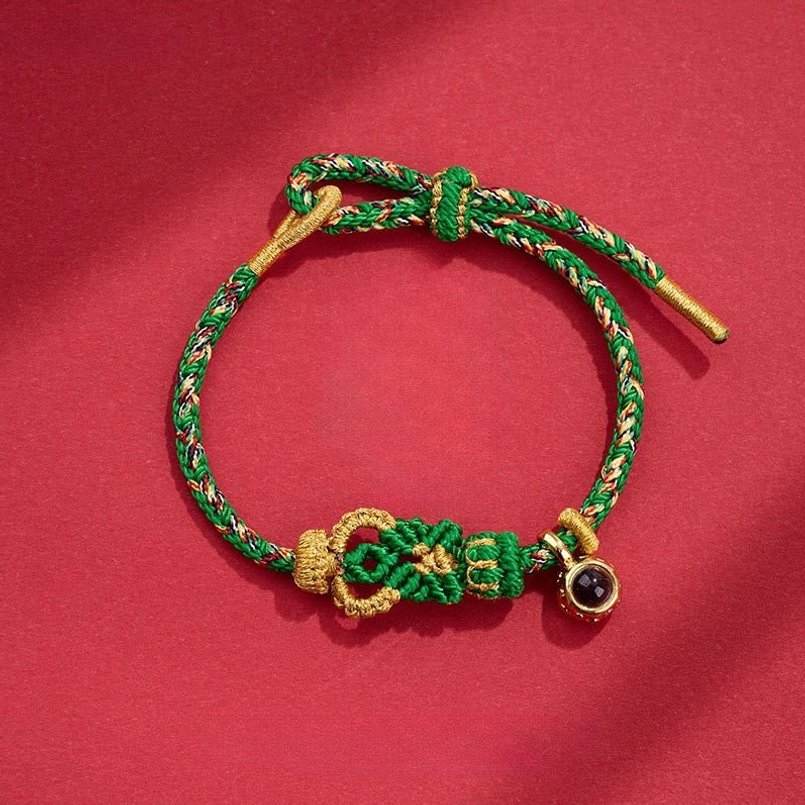 Green gold braided Buddha knot red string bracelet with round stone charm