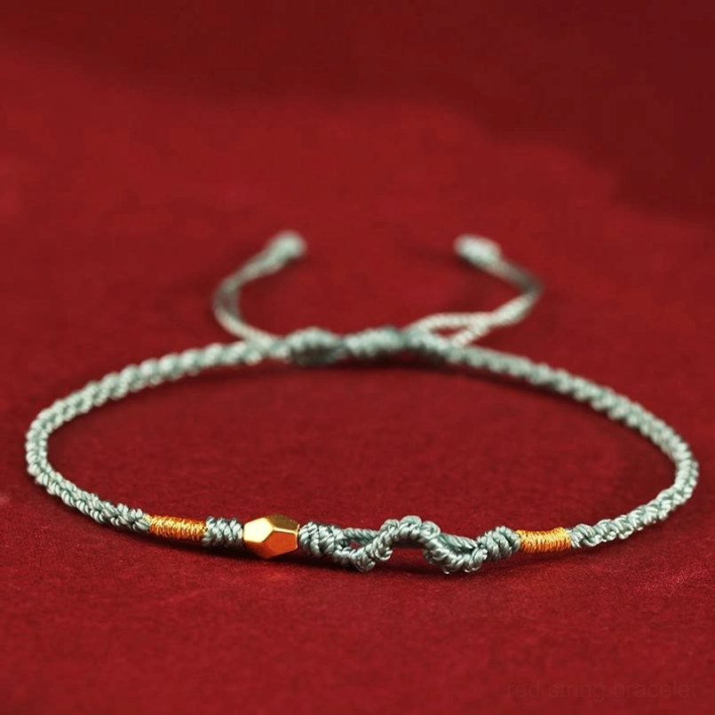 Green 999 gold year of the snake red string bracelet flat lay display