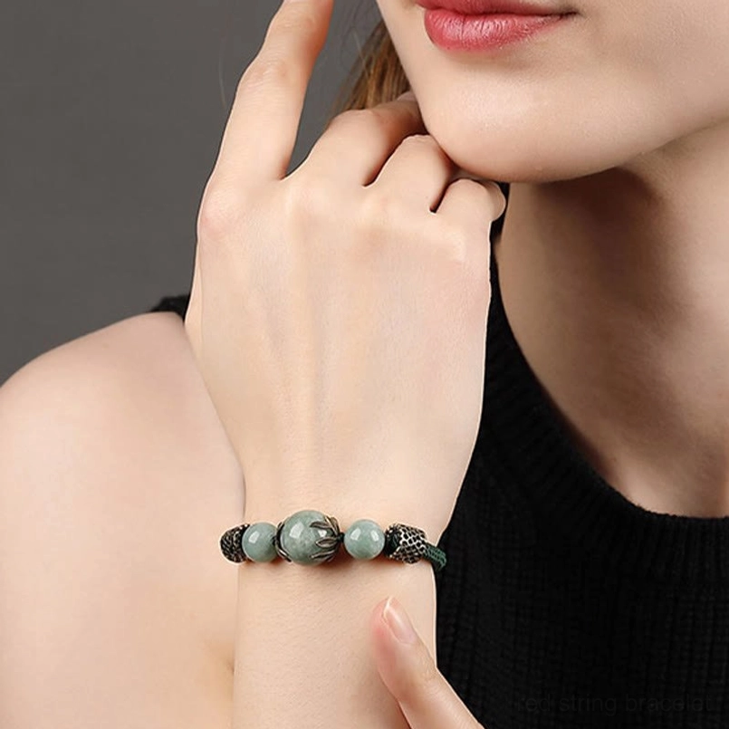 Minimalist green jade prosperity bracelet with simple bead arrangement on wrist