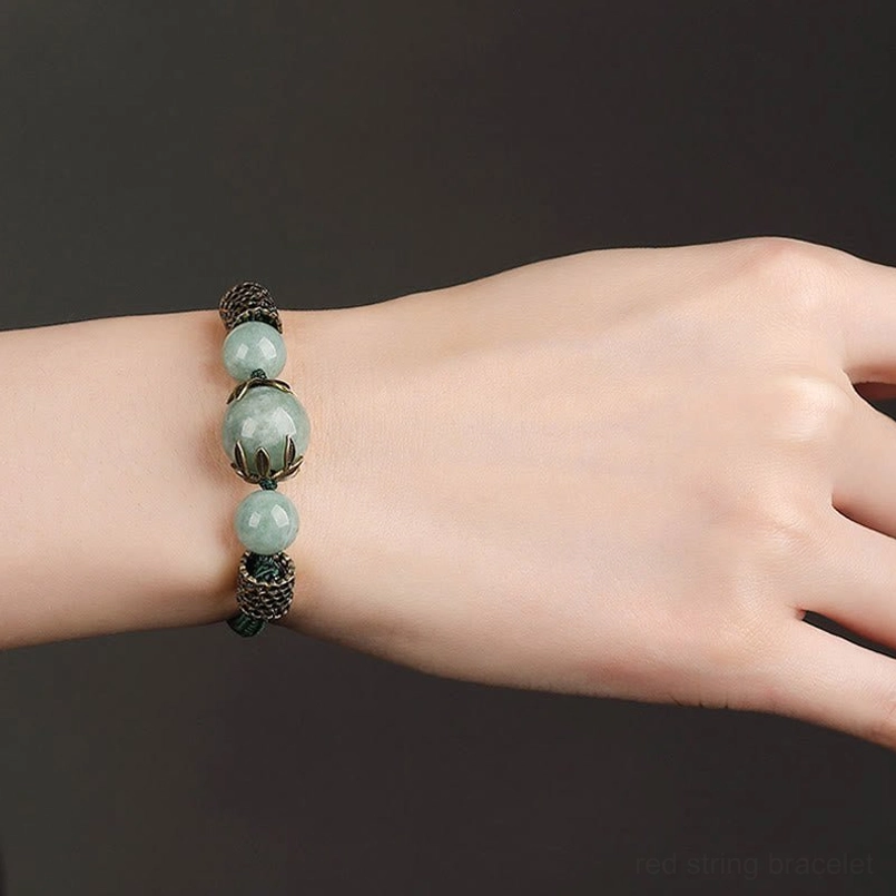 Compact green jade harmony bracelet with bronze accents - side profile wrist shot
