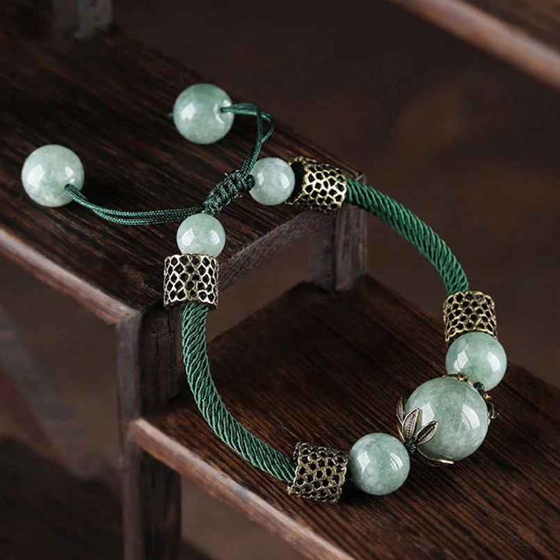 Handmade green jade harmony bracelet featuring braided cord and antique bronze bead caps
