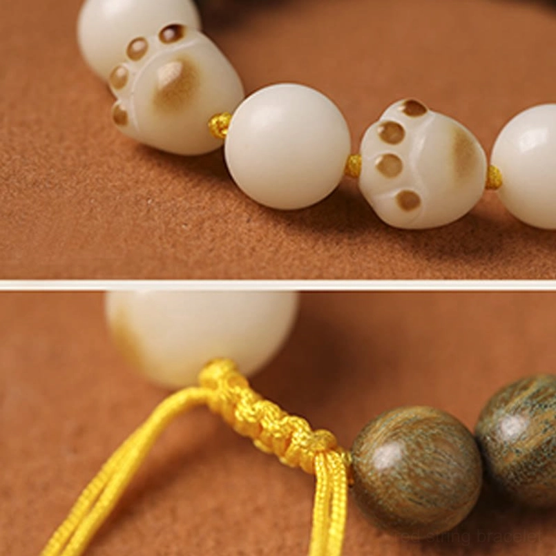 Close Up of Cat Paw Bodhi Bead and Green Sandalwood Bracelet Beads