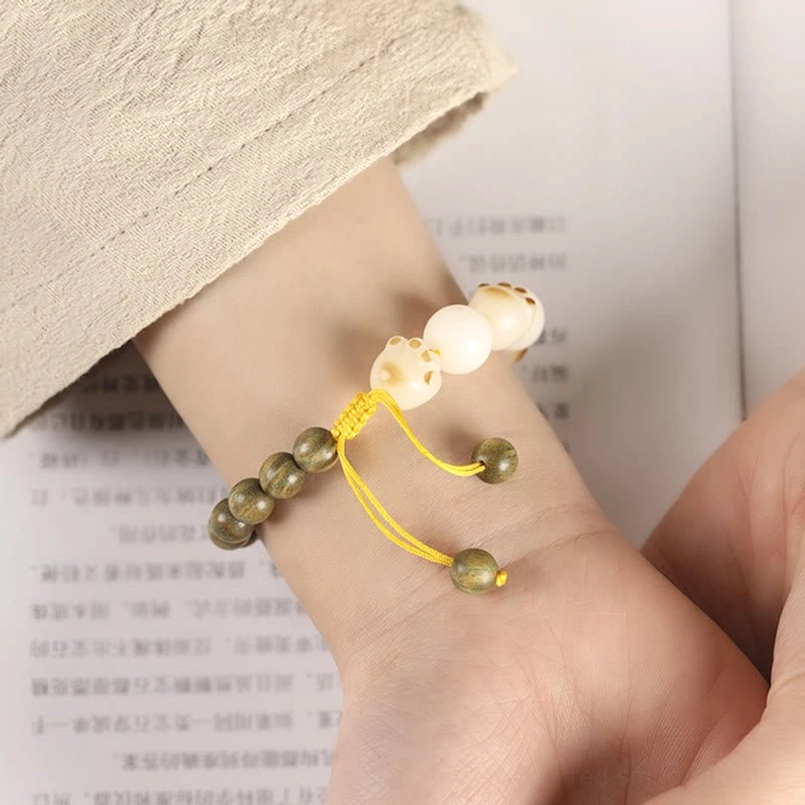 Close Up Wrist Wear View of Green Sandalwood Bodhi Cat Paw Bracelet