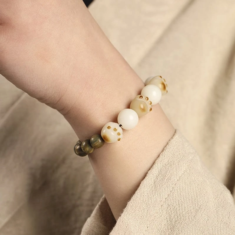 Fitted Wrist Side View of Green Sandalwood Bodhi Cat Paw Healing Bracelet