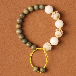 Natural Green Sandalwood Bodhi Seed Cat Paw Healing Bracelet Flat Lay Brown Background