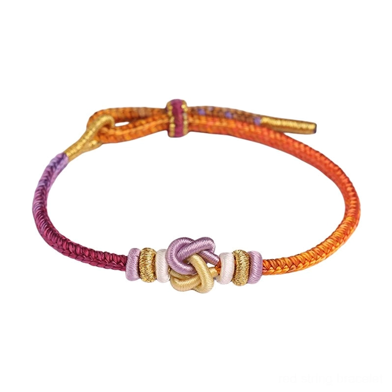 Hand-knotted protection bracelet flat lay showing tight woven rope texture and delicate knot