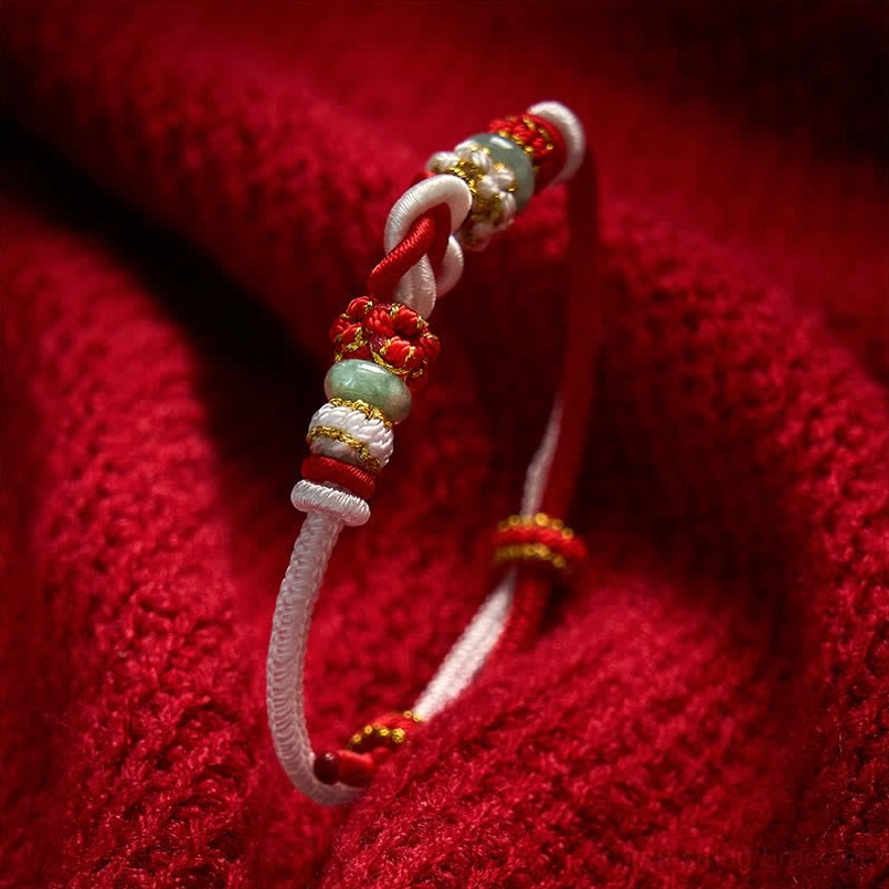 Hand-woven red string jade bracelet with natural material and authentic craftsmanship