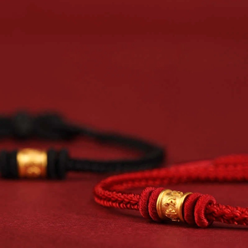 Hand woven red string Tibetan bracelet close up detail of braided cord
