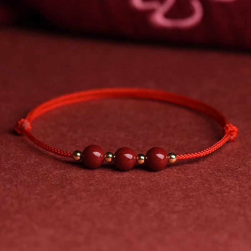 Cinnabar blessing bracelet showing handcrafted braided cord detail with natural beads