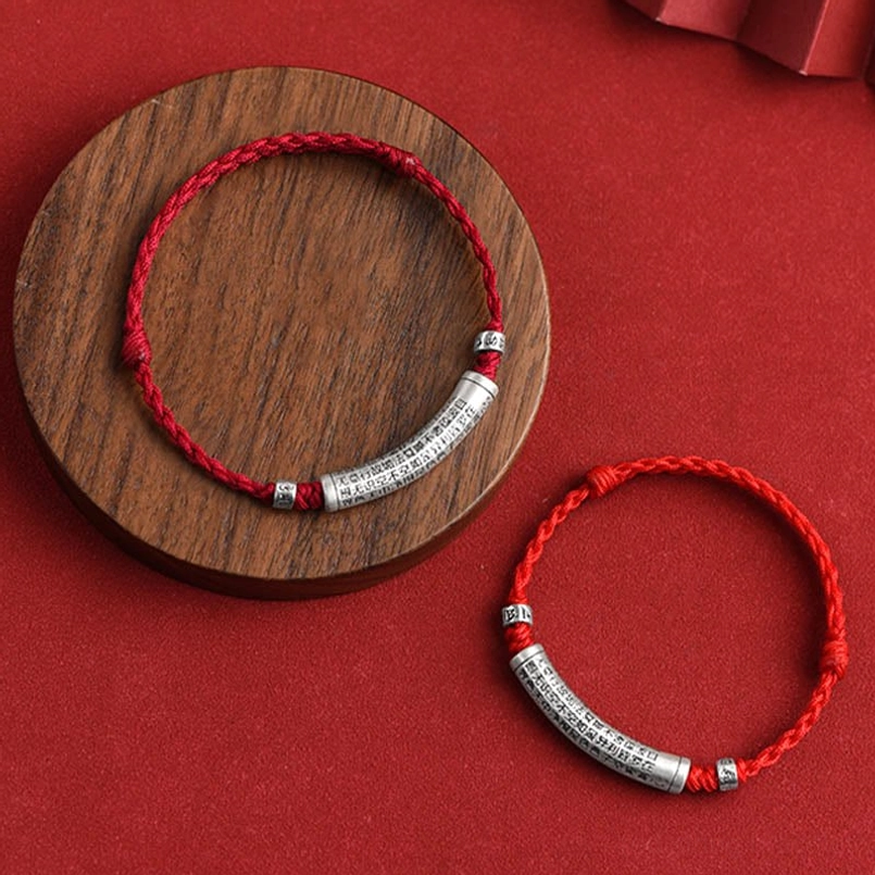 Handcrafted Heart Sutra red bracelet showcasing fine rope weaving and silver craftsmanship