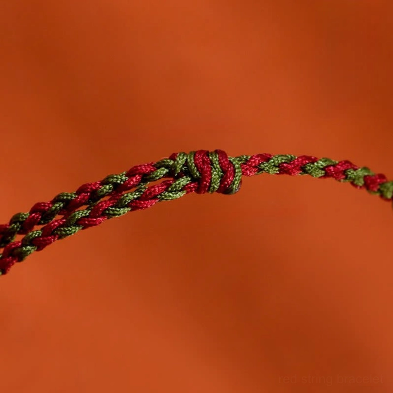 Handcrafted koi fish red string lucky bracelet product photography