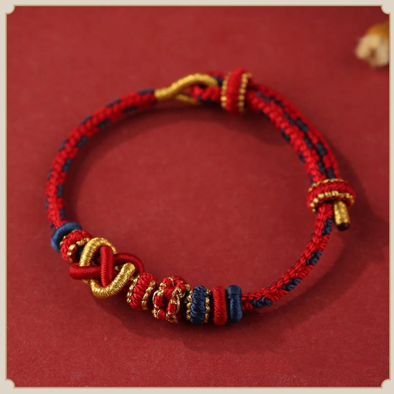 Handcrafted Red Peach Blossom Peace Knot Red String Bracelet Flat Lay View