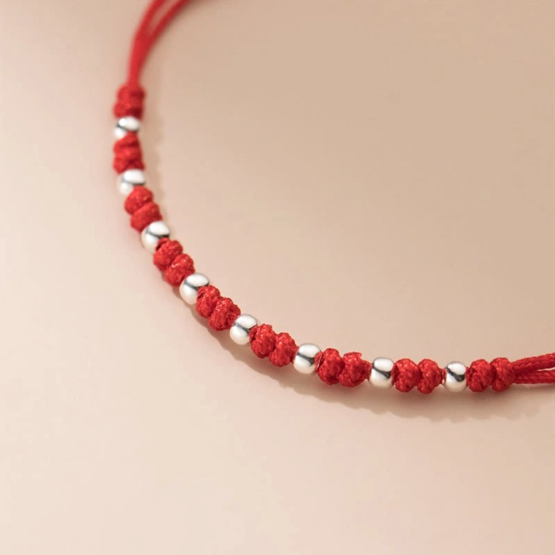 Handcrafted red cord luck bracelet featuring premium 925 sterling silver round beads