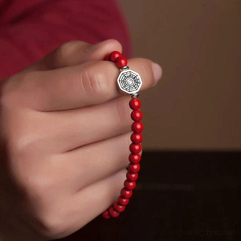 Red string bracelet with yin yang bagua charm handcrafted natural materials