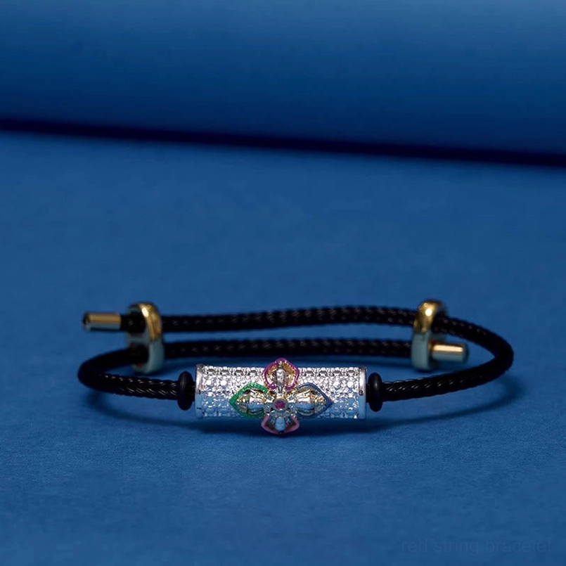 Handmade black string luck bracelet with ornate copper flower bead charm