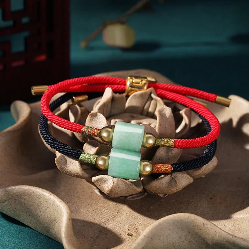 Handmade red string braided bracelets with stacked green aventurine beads and adjustable gold hardware