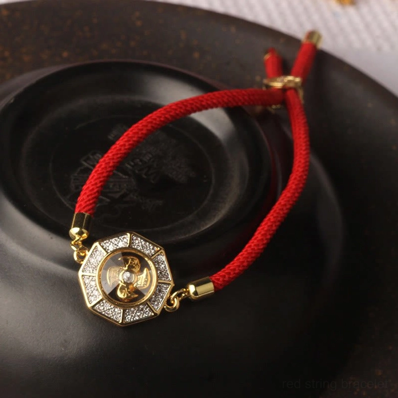 Handmade feng shui red string windmill bracelet showcasing craftsmanship, rotating charm, and adjustable fit