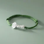 Handmade green string bracelet with 999 sterling silver fu character ruyi charm