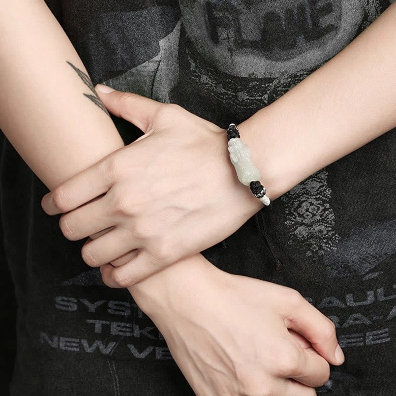 Handmade jade Pixiu luck charm bracelet - close-up of natural stone quality