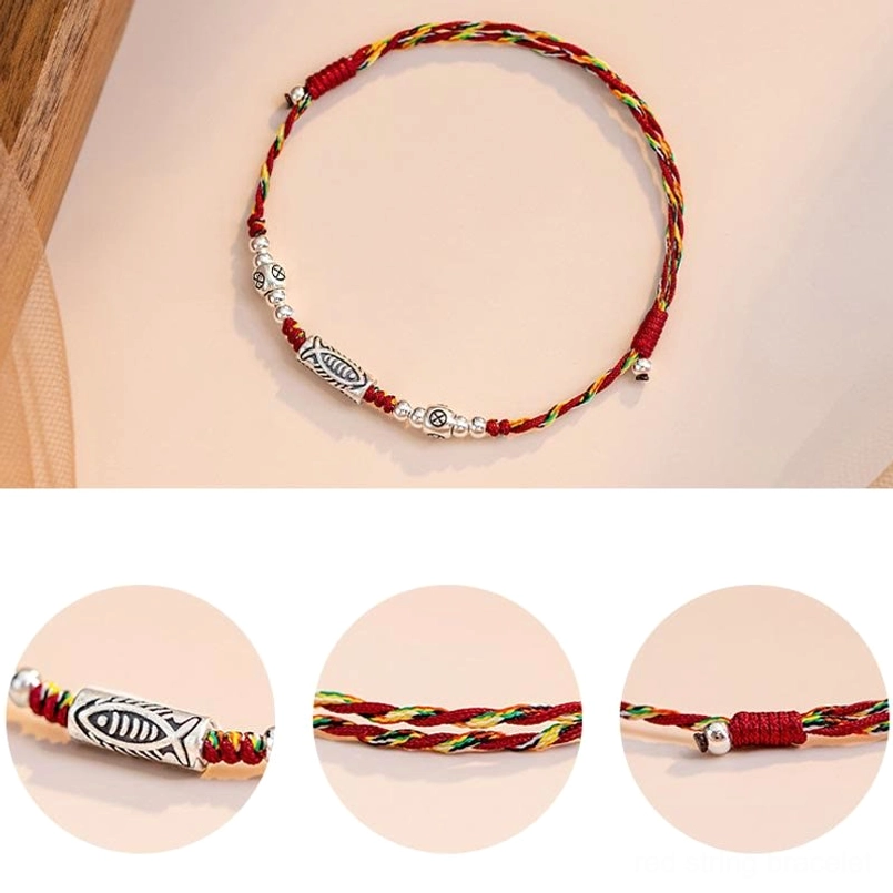 Handmade red string koi fish bracelet with natural materials and sterling silver details