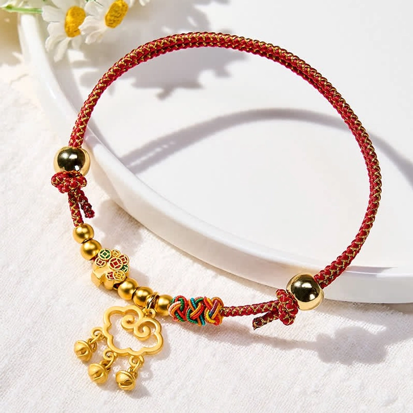 Handmade lucky pet collar with intricate red string braids and metal charm details