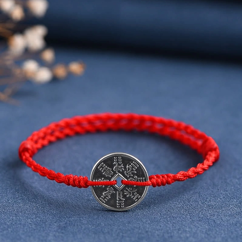Hand-woven red braided cord with sterling silver coin protection bracelet