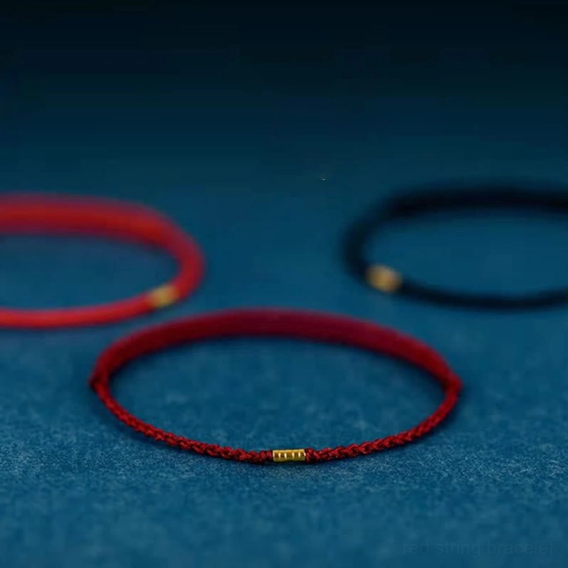 Lucky red string bracelet with golden beads handmade detail