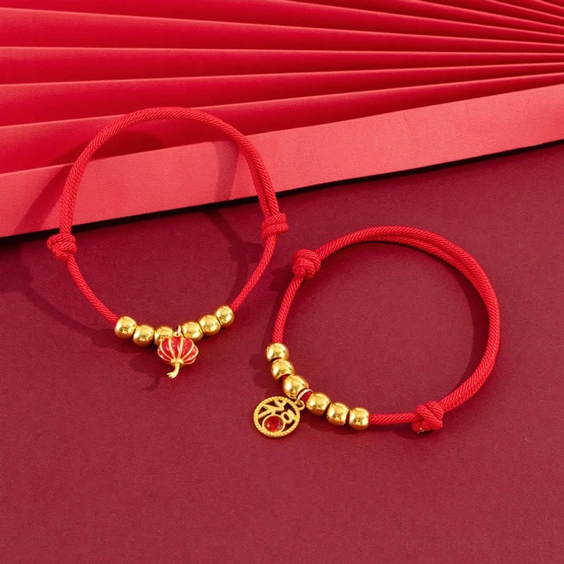 Handmade red pet collar with lantern pattern charm, detail shot showing craftsmanship and materials